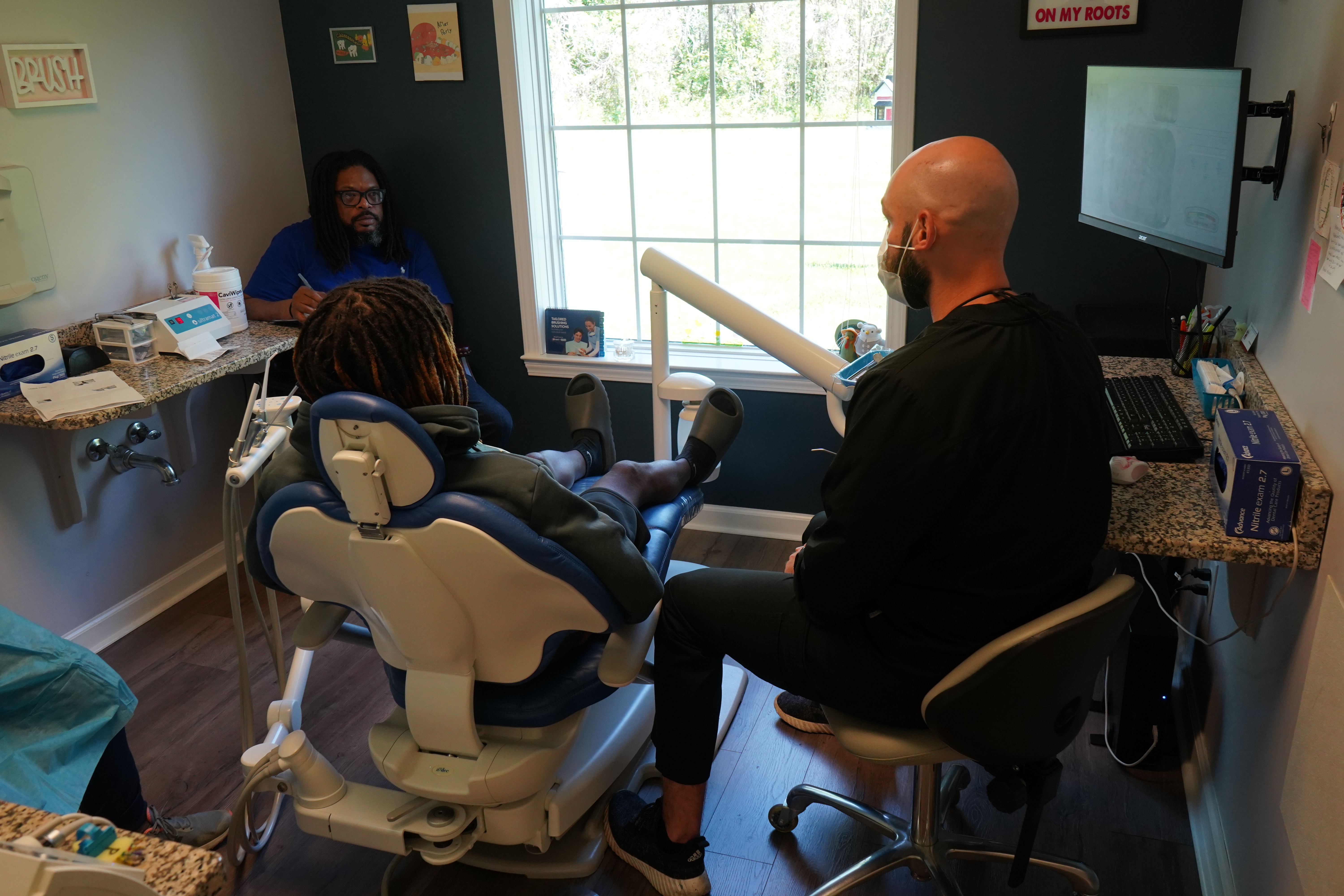 woman putting x ray pad on patient